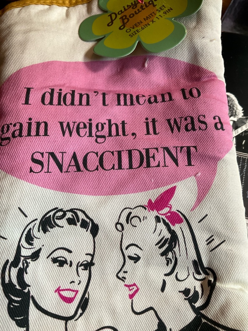 "Snaccident" oven mitt set from the Daisy Boutique Brand Pink and Yellow - Picture 2 of 7